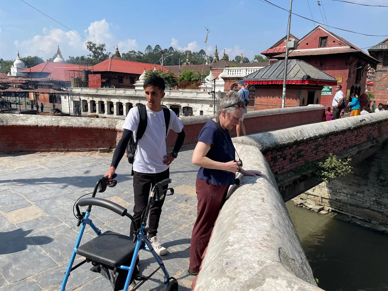 Professional carer supporting a traveler during an accessible holiday in Nepal